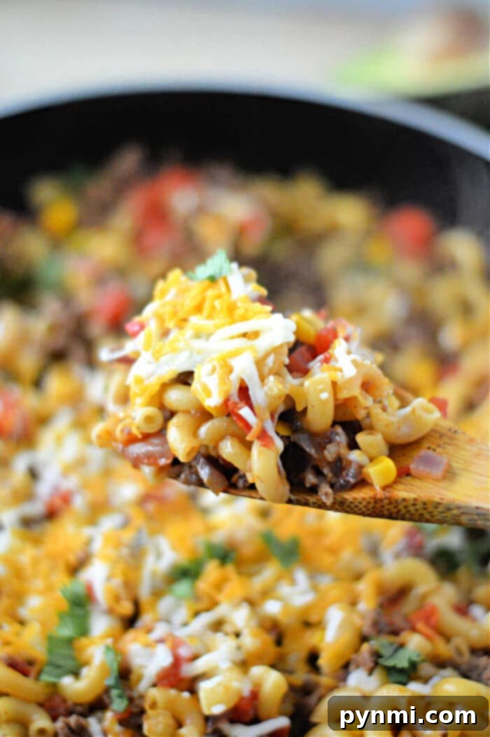 Crunchy Taco Beef Skillet 7 Large serving of Taco Hamburger Helper in a skillet, topped with fresh ingredients.