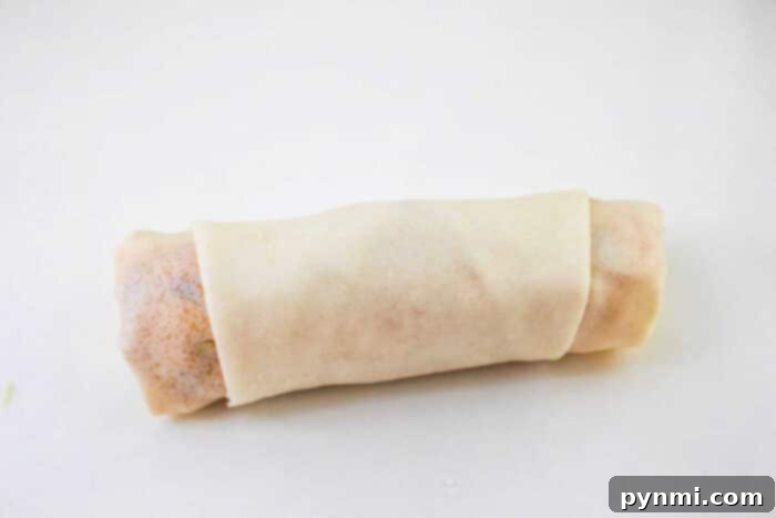 Close-up of spring roll filling with shredded cabbage and other vegetables.