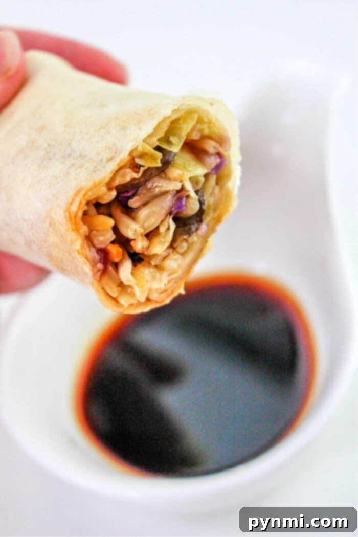 A bowl of homemade spring roll dipping sauce, garnished with red pepper flakes.