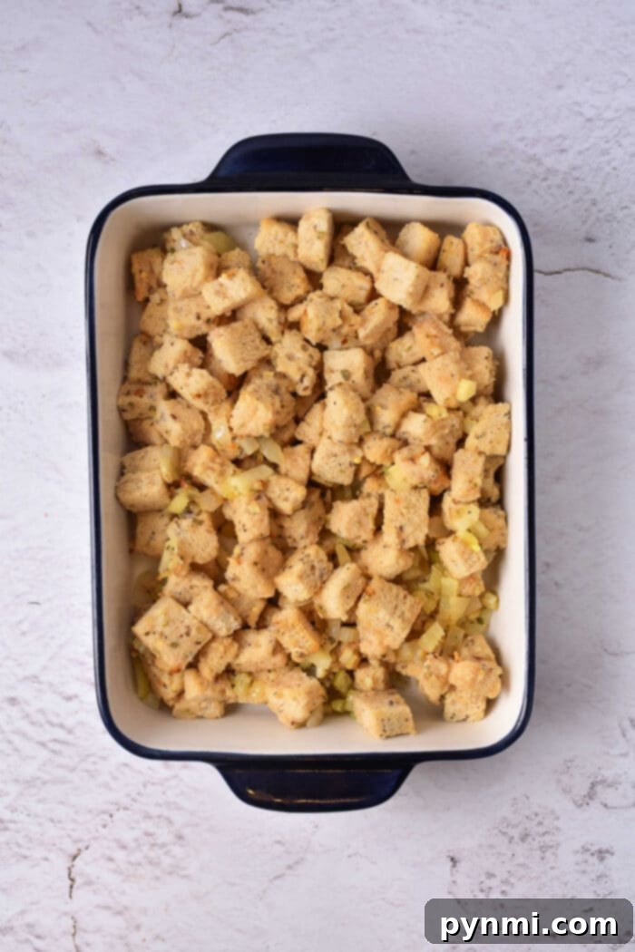 Golden Sourdough Croutons 6 A bowl of freshly baked, golden-brown gluten-free croutons, ready to be served. The croutons are evenly toasted and appear crisp, with subtle seasoning visible on their surfaces.