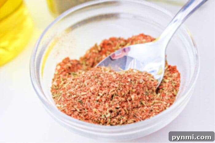 Perfect Half Chicken: Roasting Time at 400F 5 Close-up of a homemade chicken dry rub mix, showcasing its rich colors and textures.