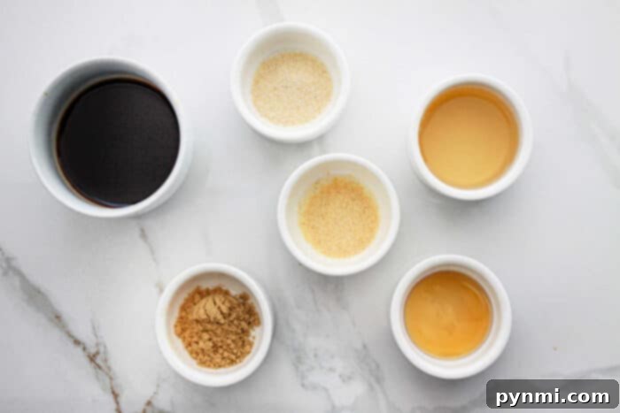 Close-up of key ingredients like soy sauce, apricot jam, and spices, vital for authentic egg roll sauce flavors.