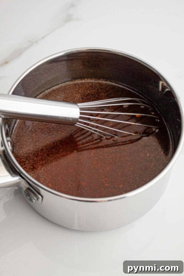 Huli Huli sauce in a pot simmering on the stove
