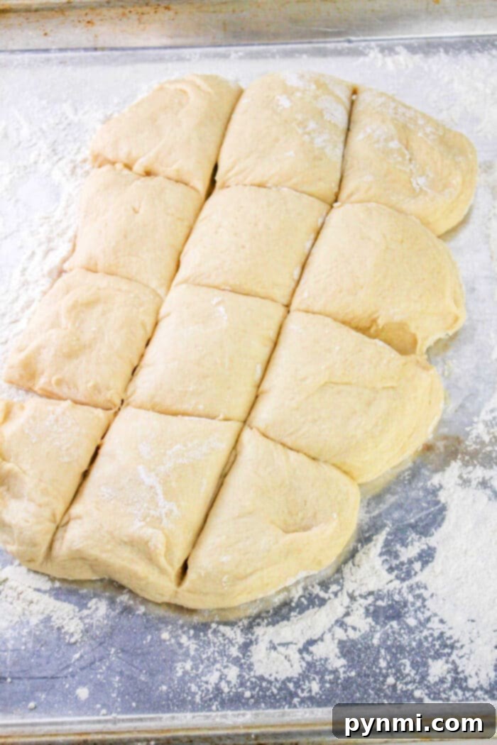 Adorable Easter Bunny Bread 6 Divided dough pieces on a floured surface, ready for baking, perfect for crafting your favorite Bunny Bread recipe.