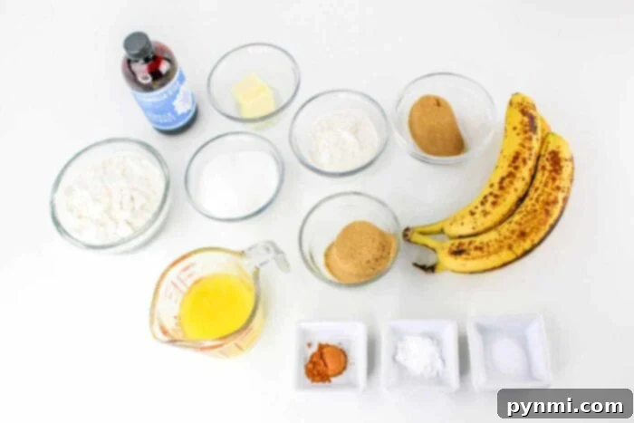 Aromatic Banana Spice Bread 3 Key ingredients for Banana and Cinnamon Bread laid out on a kitchen counter, showing ripe bananas