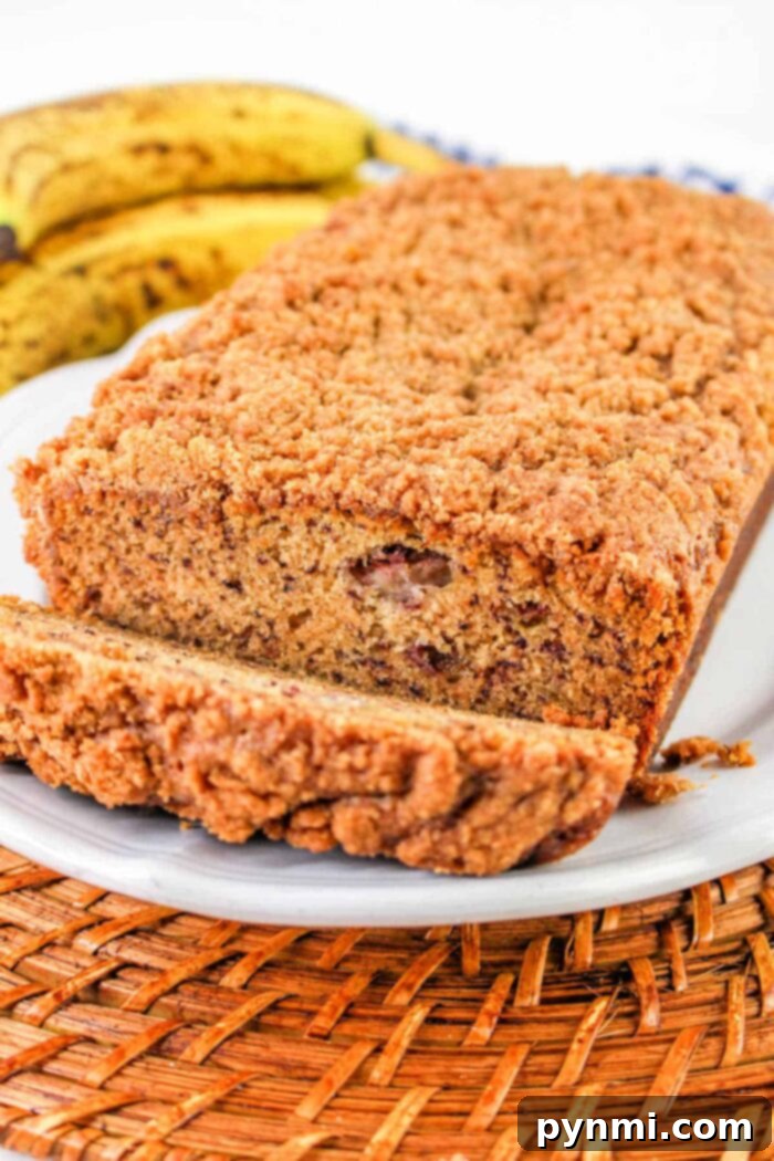 Aromatic Banana Spice Bread 7 Close-up slice of moist Cinnamon Banana Bread with streusel topping, showcasing texture