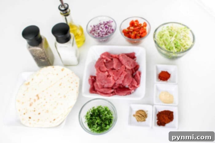 Mouthwatering Pork Tenderloin Tacos 4 Ingredients for a meal are arranged on a white surface, including tortillas, raw pork slices, chopped cilantro, shredded cabbage, diced red onions, chopped red peppers, various spices in small dishes for making Pork Tenderloin Tacos, a bottle of olive oil, and salt and pepper shakers.