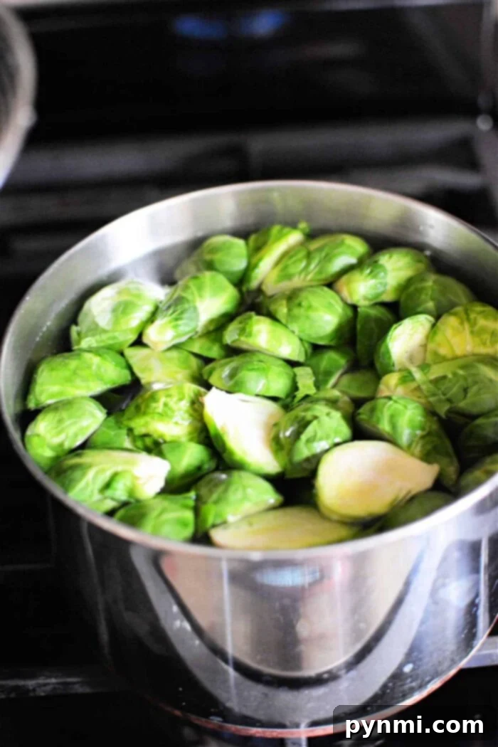 Boiling Brussel Sprouts The Perfect Timing 5 Brussels sprouts simmer gently in a stainless steel pot on the stovetop, filling the kitchen with their earthy aroma. Aim for about 8-10 minutes for perfect tenderness.