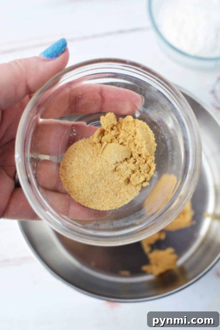A bowl of vibrant homemade dipping sauce for chicken tenders, perfectly complementing their tender texture and adding a burst of flavor to any meal.