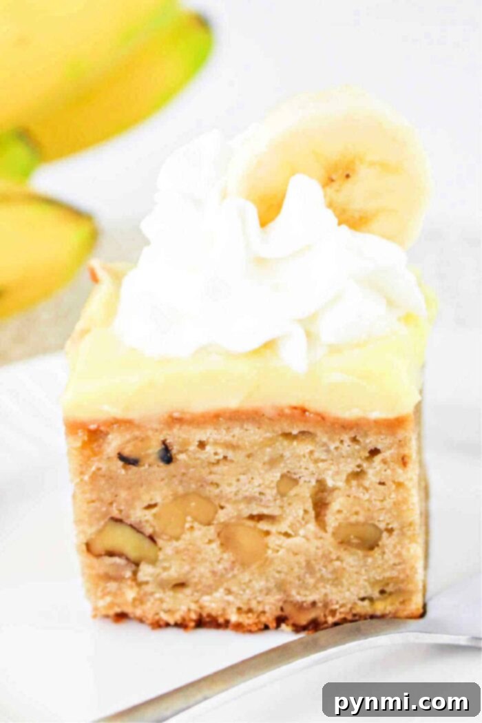 A vibrant image of a single layer banana cream cake, showcasing its rich frosting and delightful presentation.