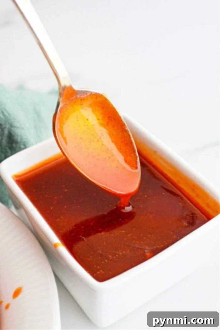 Copycat Popeyes Sweet Heat Sauce in a serving dish, ready to dip