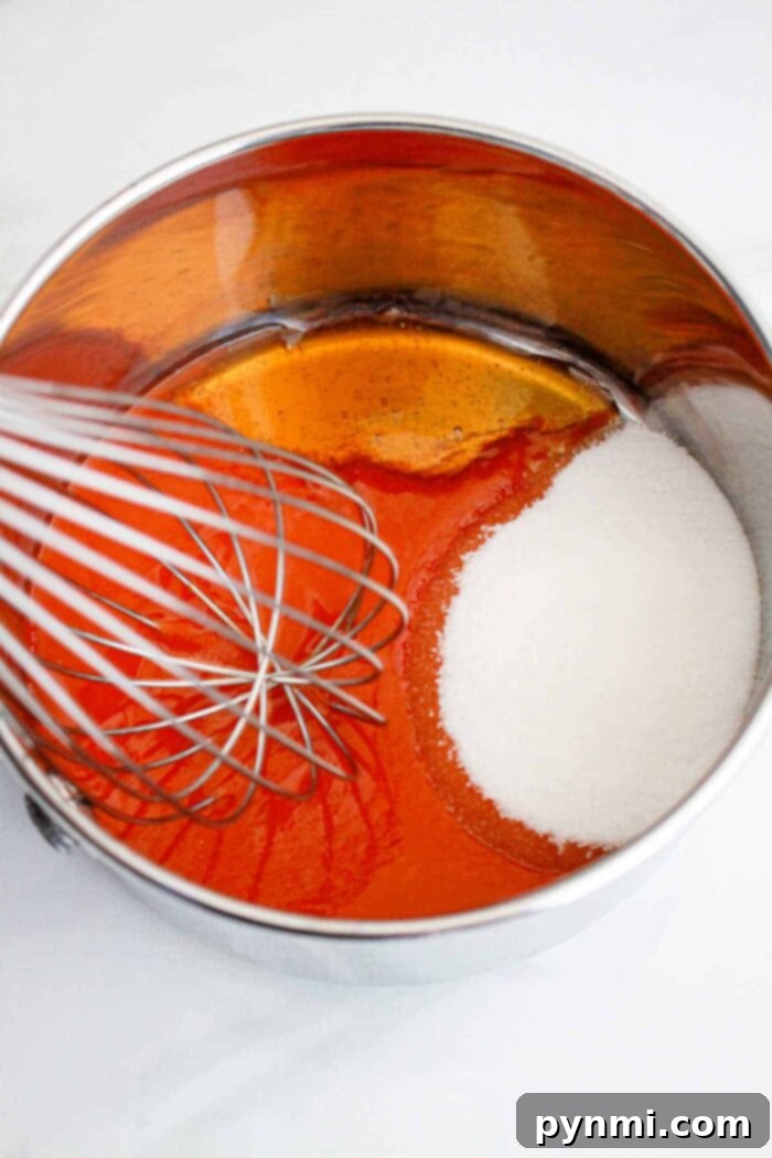 Delicious Popeyes Sweet Heat Sauce simmering in a pot, ready to be served