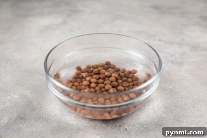 Whip Up Perfect Boba Pearls at Home 4 On a gray countertop, a glass bowl brims with tapioca pearls youd find in guides on how to cook boba for bubble tea.