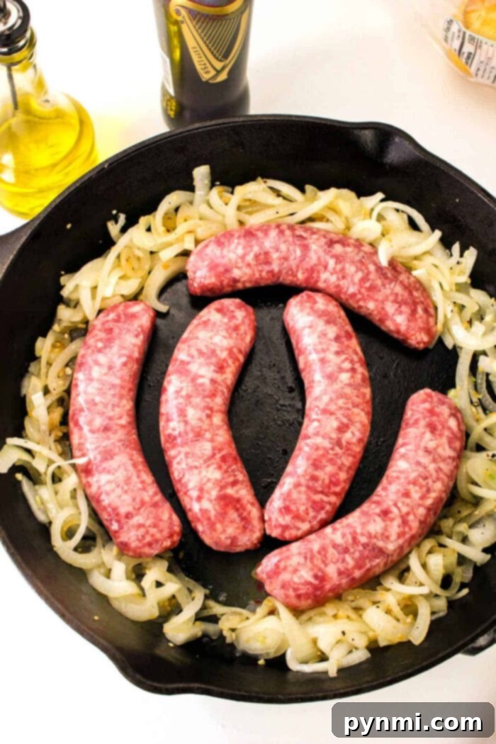 Unlocking Bratwurst Perfection 5 Five raw sausages are meticulously placed on a vibrant bed of sizzling sliced onions in a rustic cast iron skillet, providing a vivid visual guide on how to cook bratwurst to perfection. In the background, a bottle of premium olive oil and a dark bottle of Guinness beer hint at the rich flavors being prepared.