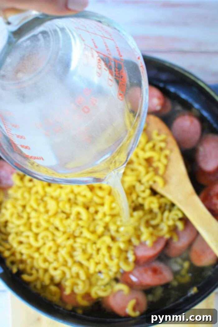 Hearty Kielbasa Pasta Skillet 4 A skillet filled with creamy Polish kielbasa and pasta, ready to be served.