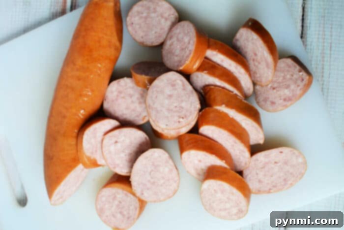 Sliced kielbasa, ready for the slow cooker, showcasing its enticing texture