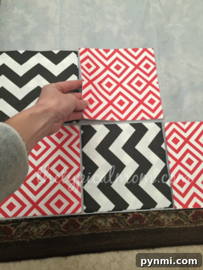 Do-It-Yourself Giant Checker Board Game: Assemble with Napkins, Tablecloth, and Juice Pouches for Cheap Activities! DIY checker board game being assembled with napkins and a tablecloth for kids