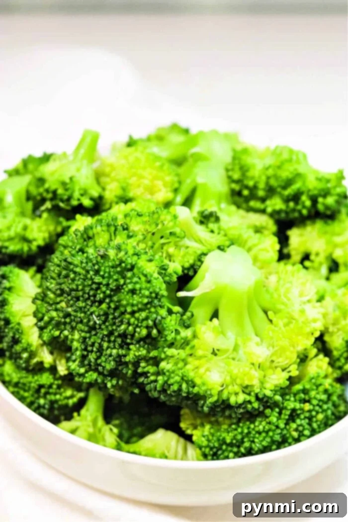 Crispy Ninja Foodi Air Fryer Broccoli 2 Vibrant green broccoli florets ready to be cooked in a Ninja Foodi for a healthy side dish