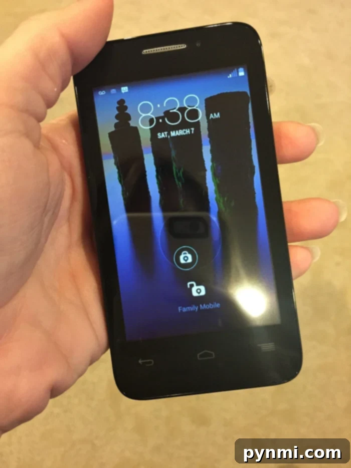 Close-up of a person gently cleaning their phone screen with a microfiber cloth, emphasizing scratch-free cleaning.
