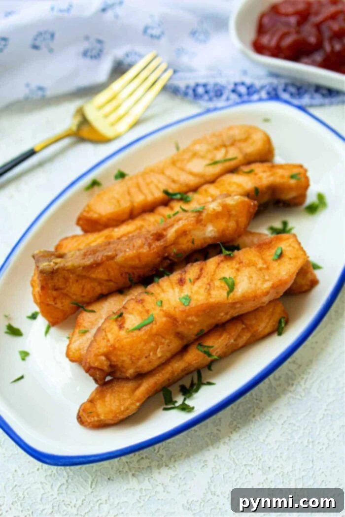 Crispy Floured Salmon 2 Crispy deep-fried salmon fillets with a golden-brown flour coating