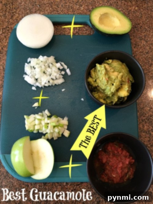 I have two of the best guacamole recipe dips here made with diced onion, salsa and our secret ingredient to make it totally fabulous is fruit! That's right, you've got to try our pineapple guacamole or add a bit of diced apple for a salty sweet dip that's perfect with chips or pretzels. #guacamole #dip #pineapple A bowl of the best guacamole recipe, perfectly chunky