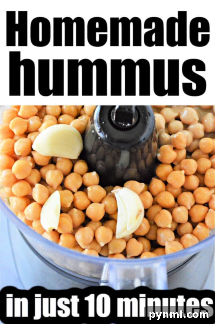 A bowl of creamy, easy hummus, garnished with a sprinkle of paprika and a drizzle of olive oil, ready for dipping with fresh vegetables.