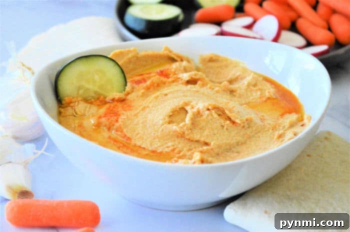 Ingredients for making homemade hummus laid out on a counter, emphasizing simplicity.