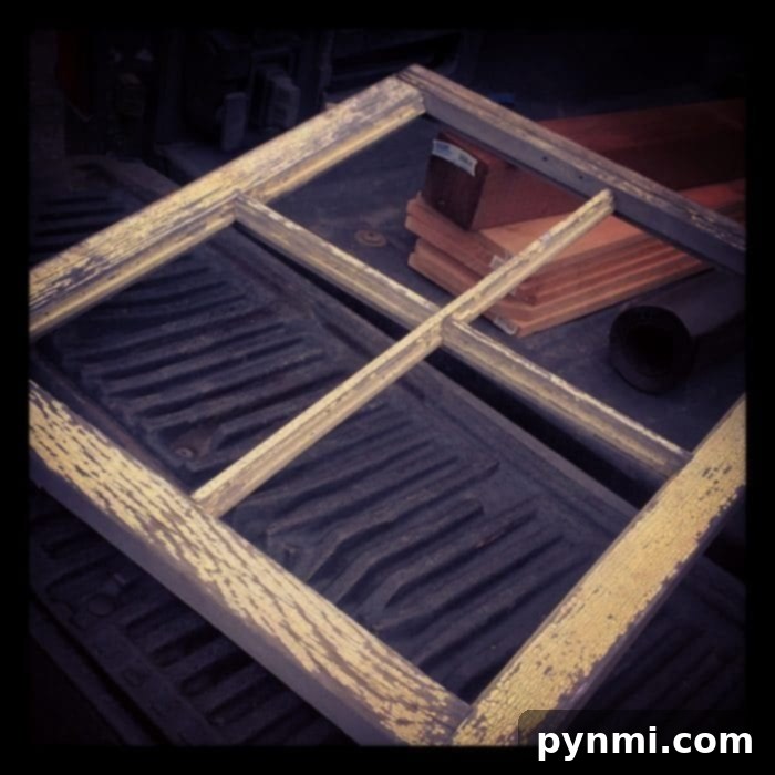 A close-up of a Little Free Library's construction, showing the roof and side panel details.