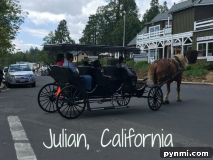 Julian California A Golden Slice of Apple Country 2 Charming horse-drawn carriage on a main street in Julian California, surrounded by historic buildings and visitors.