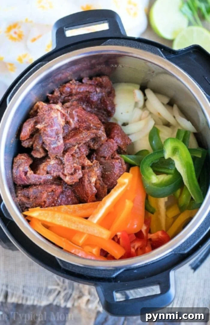 Fast Flavor: Instant Pot Weeknight Meals 2 Effortless weeknight dinners are just minutes away with this Instant Pot meal featuring seasoned meat, sliced onions, and a vibrant mix of green and red bell peppers ready for cooking.