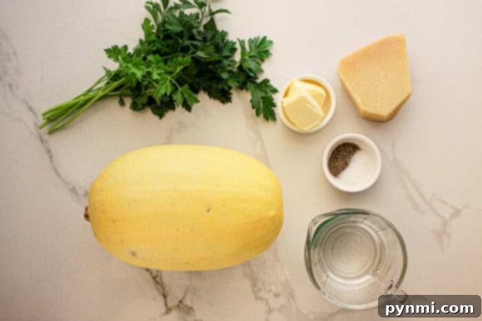 Slow Cooker Spaghetti Squash, parsley, butter, Parmesan, salt, pepper, and water rest on a marble countertop.
