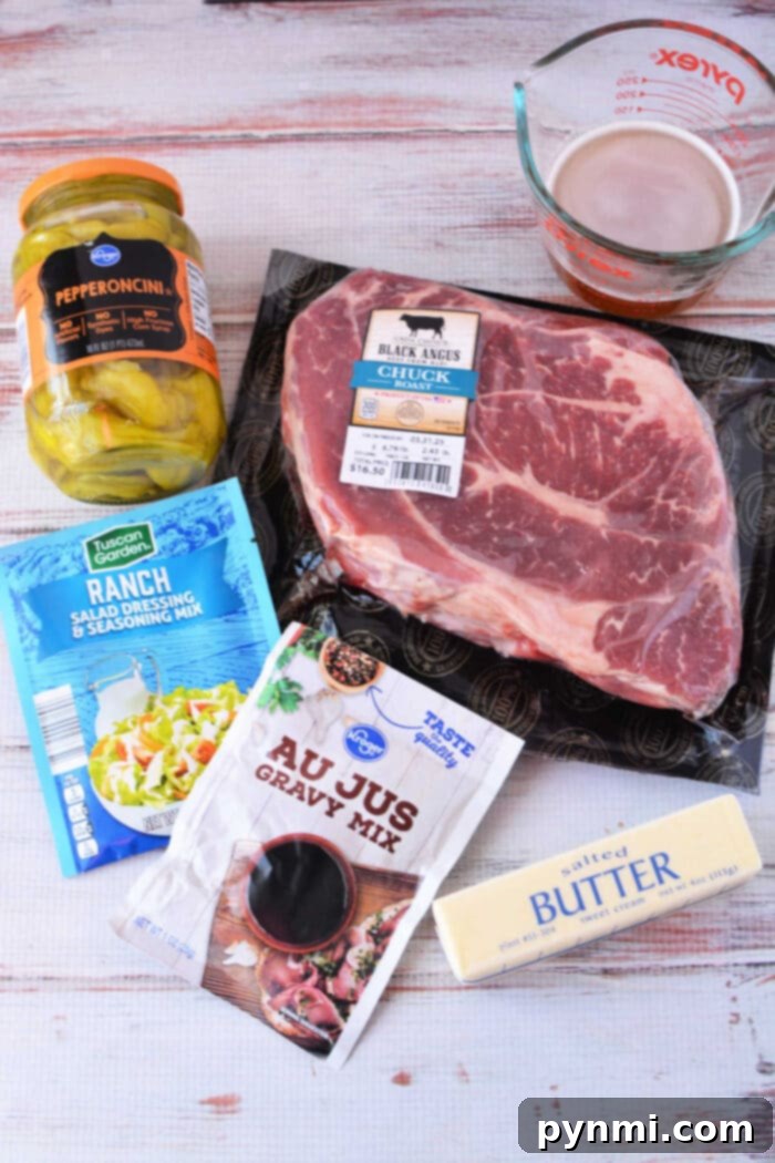 Ingredients for a Mississippi Pot Roast recipe: beef chuck roast, pepperoncini jar, au jus mix, ranch mix, butter stick, and beef broth.
