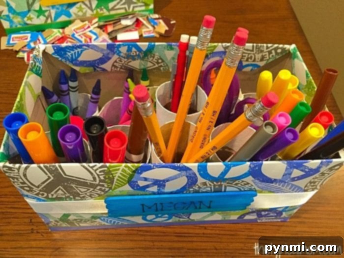 Give Kleenex Boxes a Second Life 12 A completed DIY school supply organizer made from repurposed household items, ready for use on a student's desk.