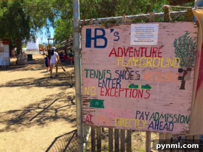 The welcoming entrance path to Huntington Beach Adventure Playground, an ideal spot for mud play and outdoor activities in Orange County.