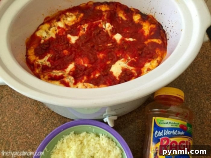 Easy crockpot lasagna recipe with no boiling required. Great pasta dinner your whole family will love using just a few ingredients and cooks quickly in your slow cooker. I will never make lasagna in the oven again after this! #crockpot #lasagna #crockpotrecipes #slowcooker #thetypicalmom #casserole crockpot lasagna recipe