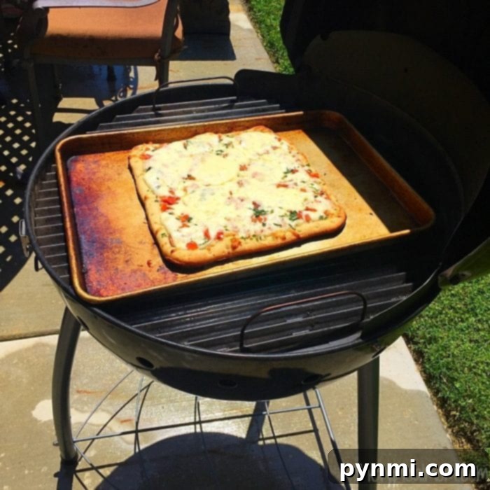 Outdoor Pizza Perfection: From Freezer to Grill 6 A perfectly cooked grilled pizza, ready to be sliced and served.