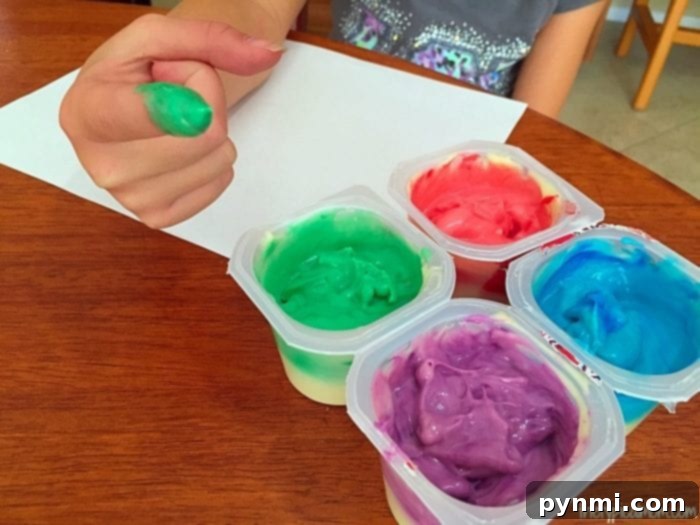 How to make edible fingerpaint. Fun and cheap activity to do with toddlers, create paint they can eat after they decorate their paper. edible fingerpaints