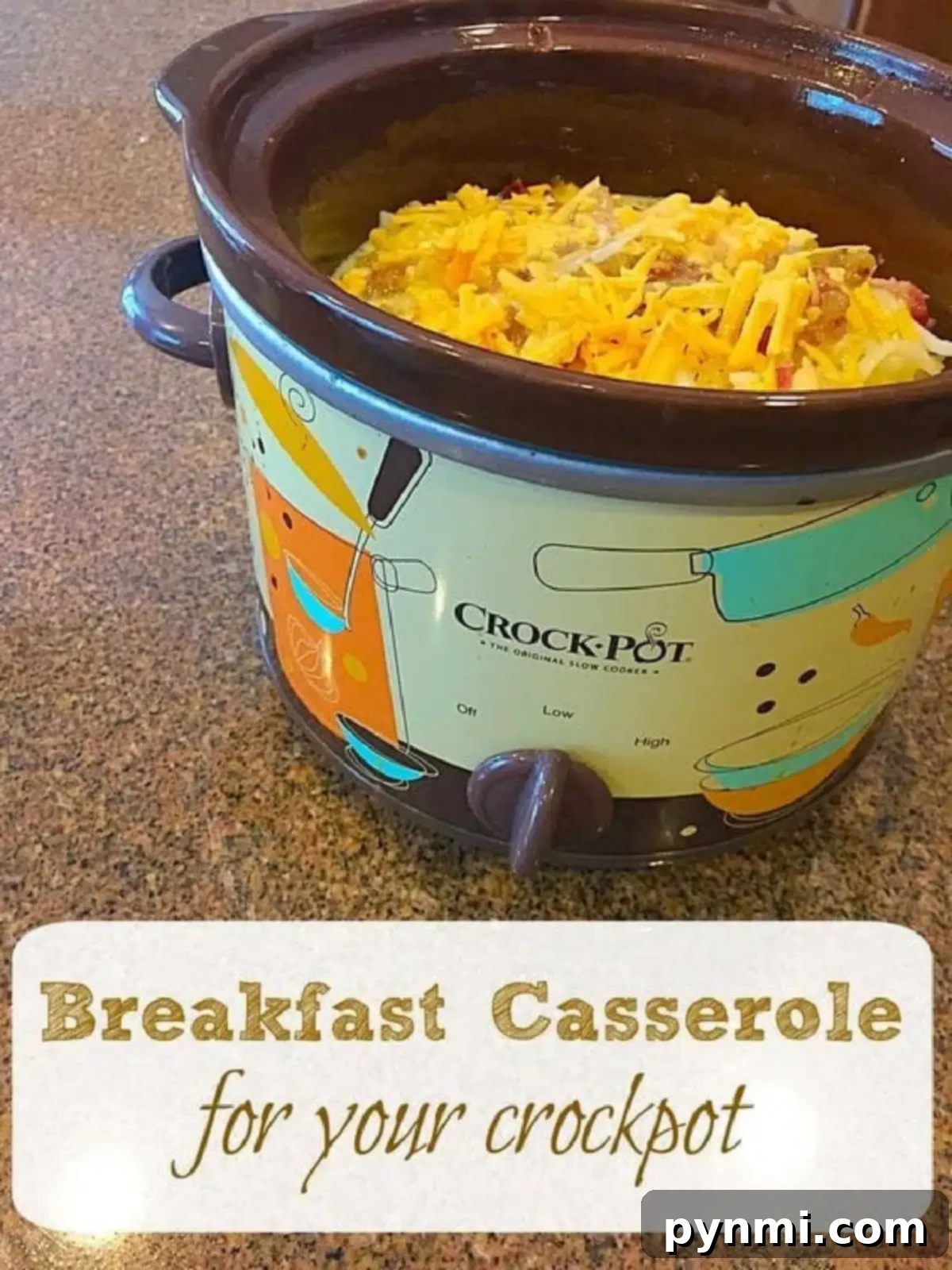 Slow Cooker Sunrise Casserole 3 A Crock-Pot filled to the brim with a mouthwatering crockpot breakfast casserole, visibly layered with ingredients and topped with melting shredded cheese.