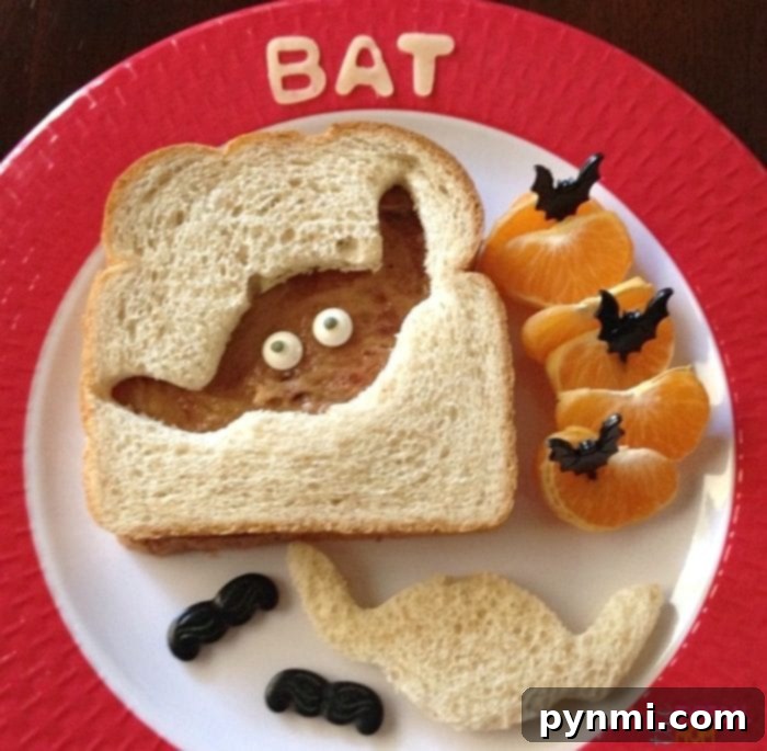 A collection of 31+ Halloween recipes for kids and parties, including fun appetizers, snacks, dinner, and desserts with pumpkin and spooky themes. A creative Halloween sandwich, demonstrating fun food ideas for kids' parties.