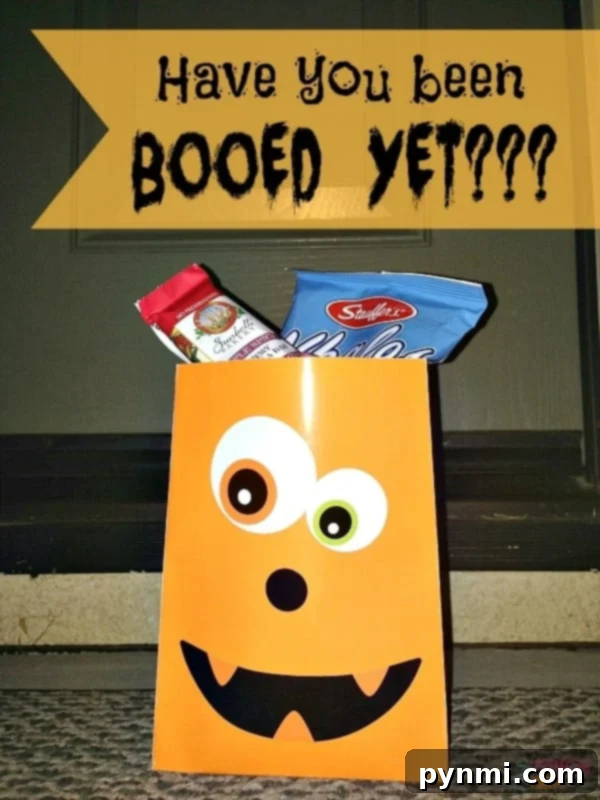 A festive 'You've Been Booed' sign alongside a collection of Halloween treats