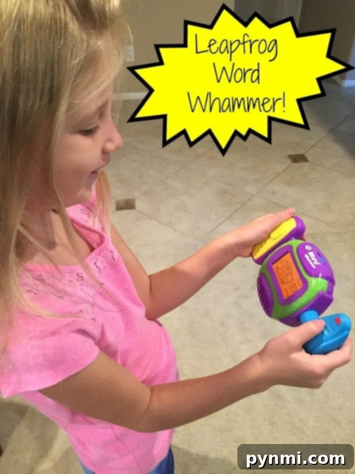The LeapFrog Word Whammer spelling practice toy makes learning fun for kids. Child enjoying LeapFrog Word Whammer spelling practice toy
