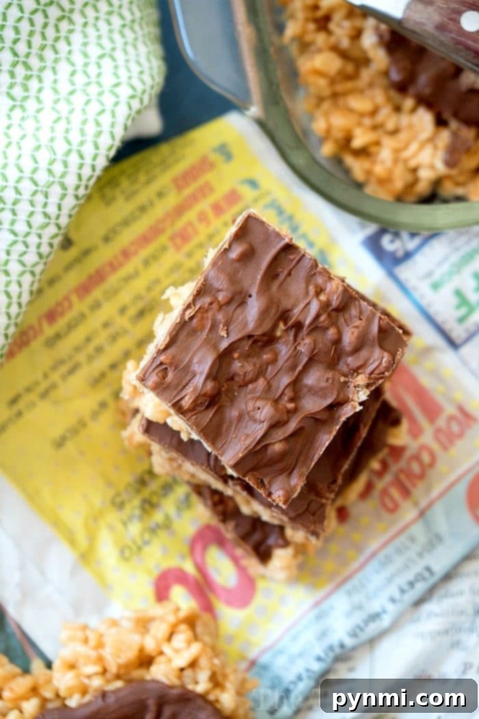 Best no-bake Scotcheroos recipe ever, featuring peanut butter, butterscotch, and chocolate with crispy cereal. Close-up of freshly made no-bake Scotcheroos with a rich chocolate and butterscotch swirl