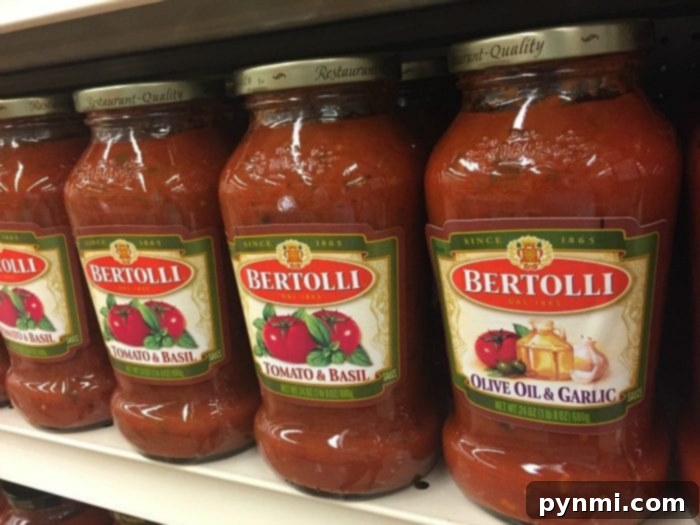 Effortless One-Pot Spaghetti 3 Bertolli spaghetti sauce being prepared in a one-pot meal.