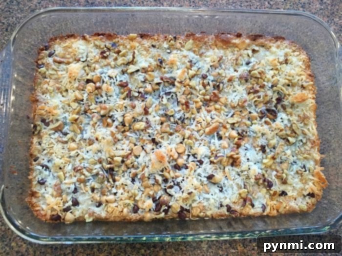 Baked 5-layer cookie bars cut into squares, ready to serve.