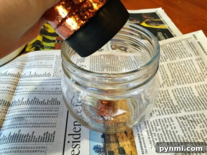 Thrifty Thanksgiving Craft Ideas 6 Applying glitter to a Thanksgiving turkey craft jar
