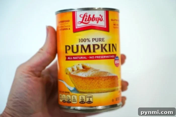 Tender Spiced Pumpkin Loaf 2 Close-up of a can of pure pumpkin puree, essential for making the most flavorful pumpkin bread.