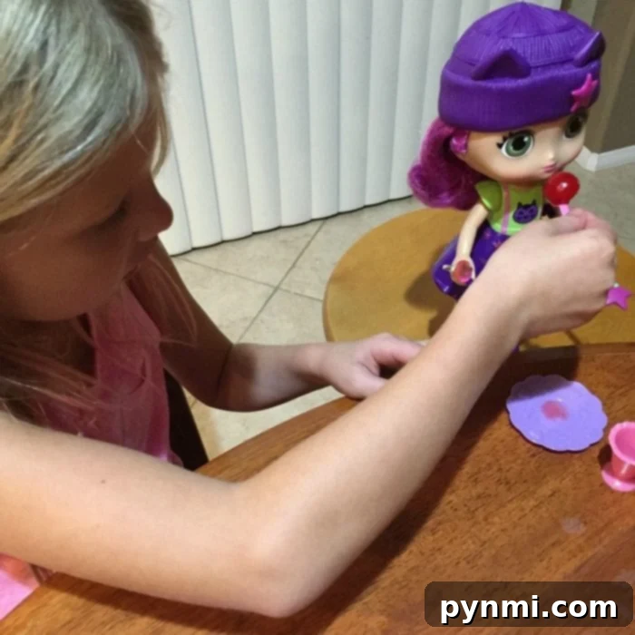 Little Charmers Hazel doll holding her wand, ready for magical adventures and pretend play
