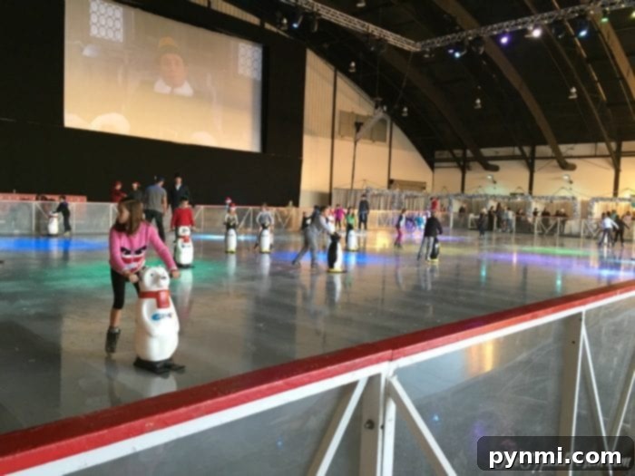 OC Winter Wonderland 4 Children ice skating with penguin helpers at OC Winter Fest