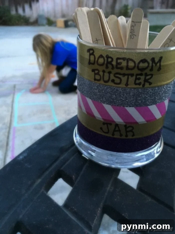 Create Your Ultimate Fun Jar 2 A vibrant boredom buster jar filled with colorful craft sticks, ready to inspire kids with free and engaging activities for indoor or outdoor play.