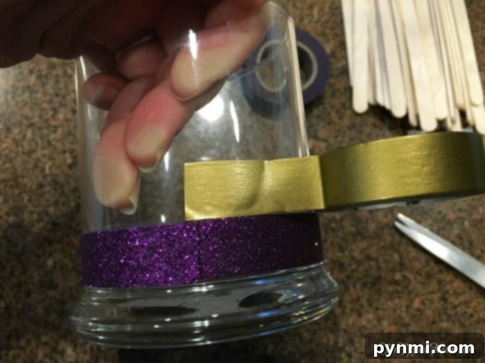 Create Your Ultimate Fun Jar 5 Colorful washi tape rolls and craft supplies laid out on a table, ready for easy and creative DIY crafts.